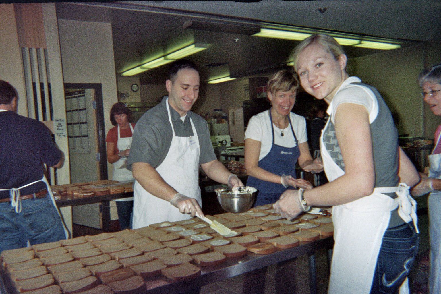 BB4CK volunteers preparing sandwiches in an early kitchen